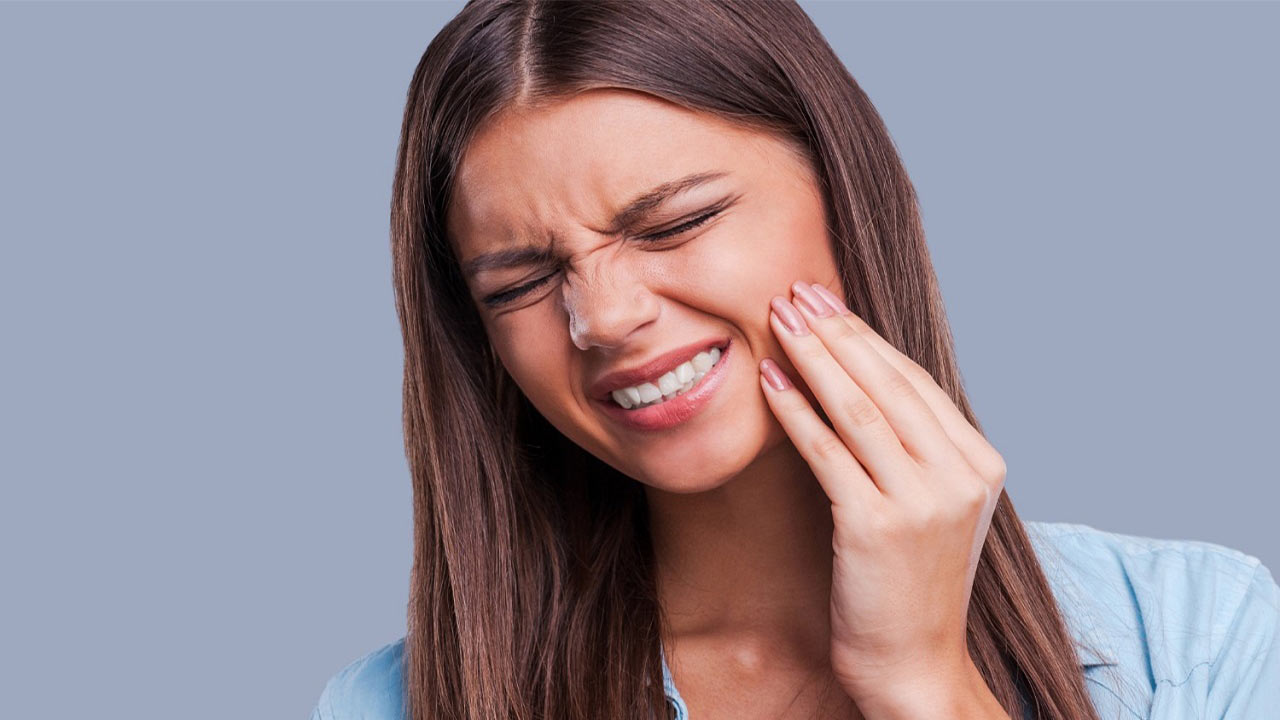 علت دندان درد چیست؟ راه های درمان درد دندان